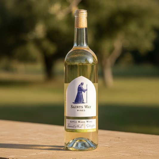 A bottle of Saint's Way Wines Apple Wine Number 2, featuring a white label with a dark blue illustration of a saint 